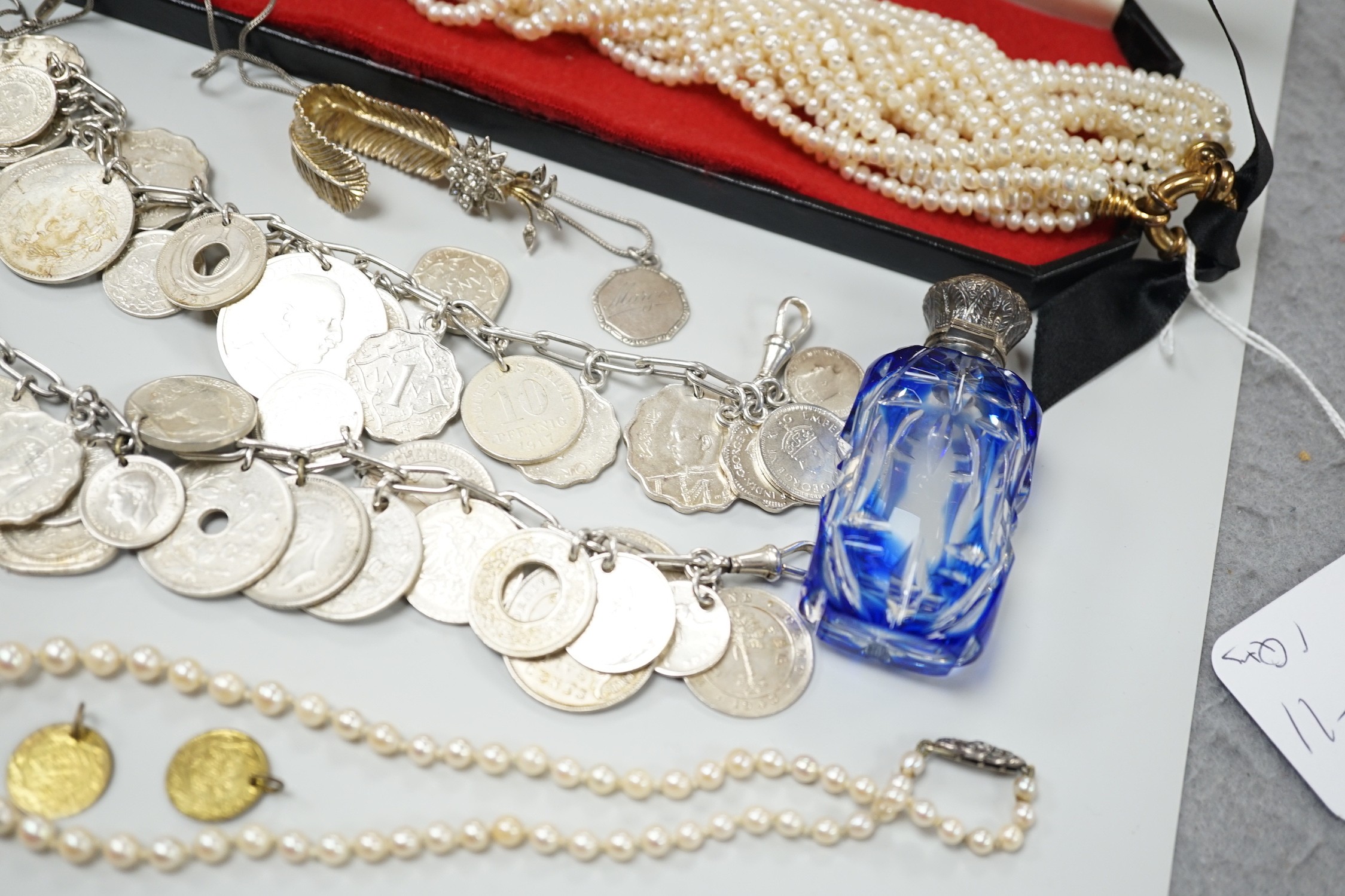 Mixed jewellery including a modern freshwater? pearl torsade necklace, 52cm, a Christian Dior 58 paste set brooch, two coin bracelets, a single strand cultured pearl necklace, mounted glass scent bottle, etc.